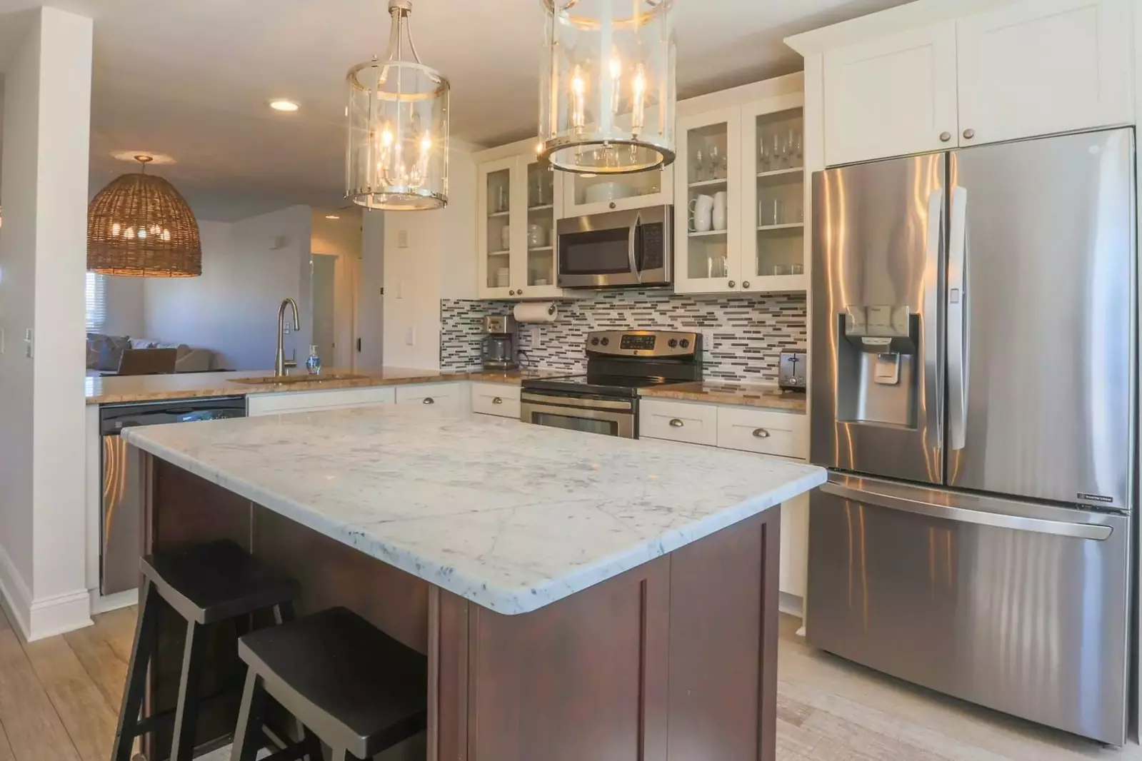 The center island provides the perfect spot to prepare your meals or converse with your family or friends.