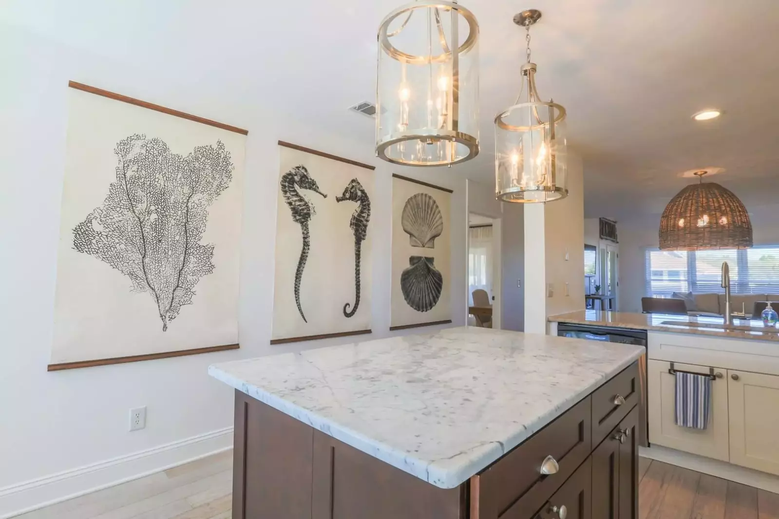 We're swooning over the large coastal-themed art pieces in the kitchen.