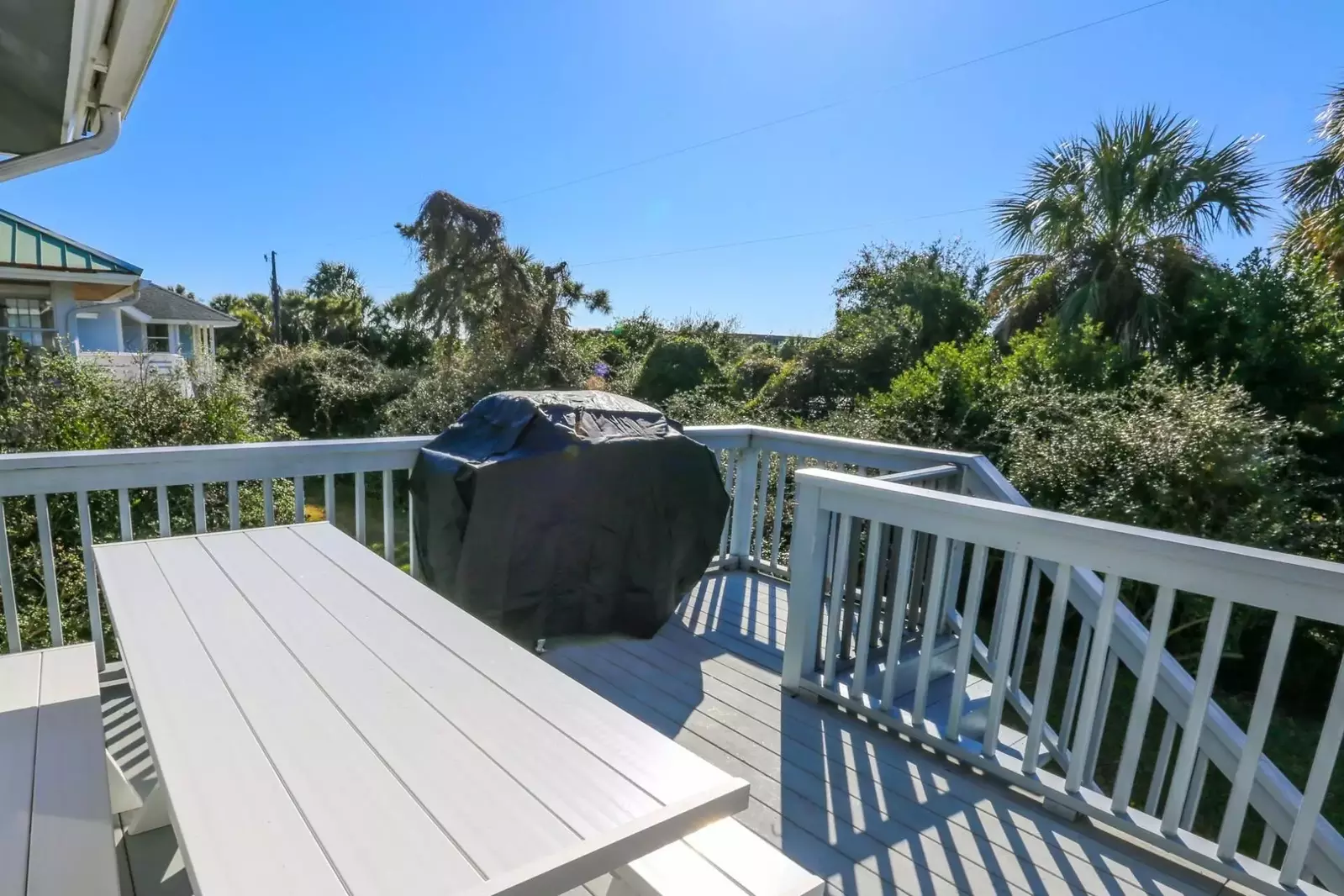 You'll find a picnic table and gas BBQ grill on the back porch.