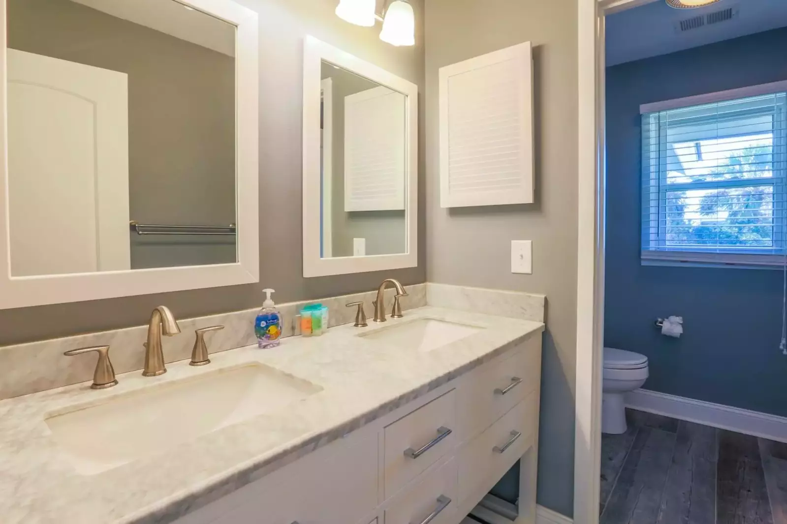 The en suite bathroom for the master suite has a double sink vanity.