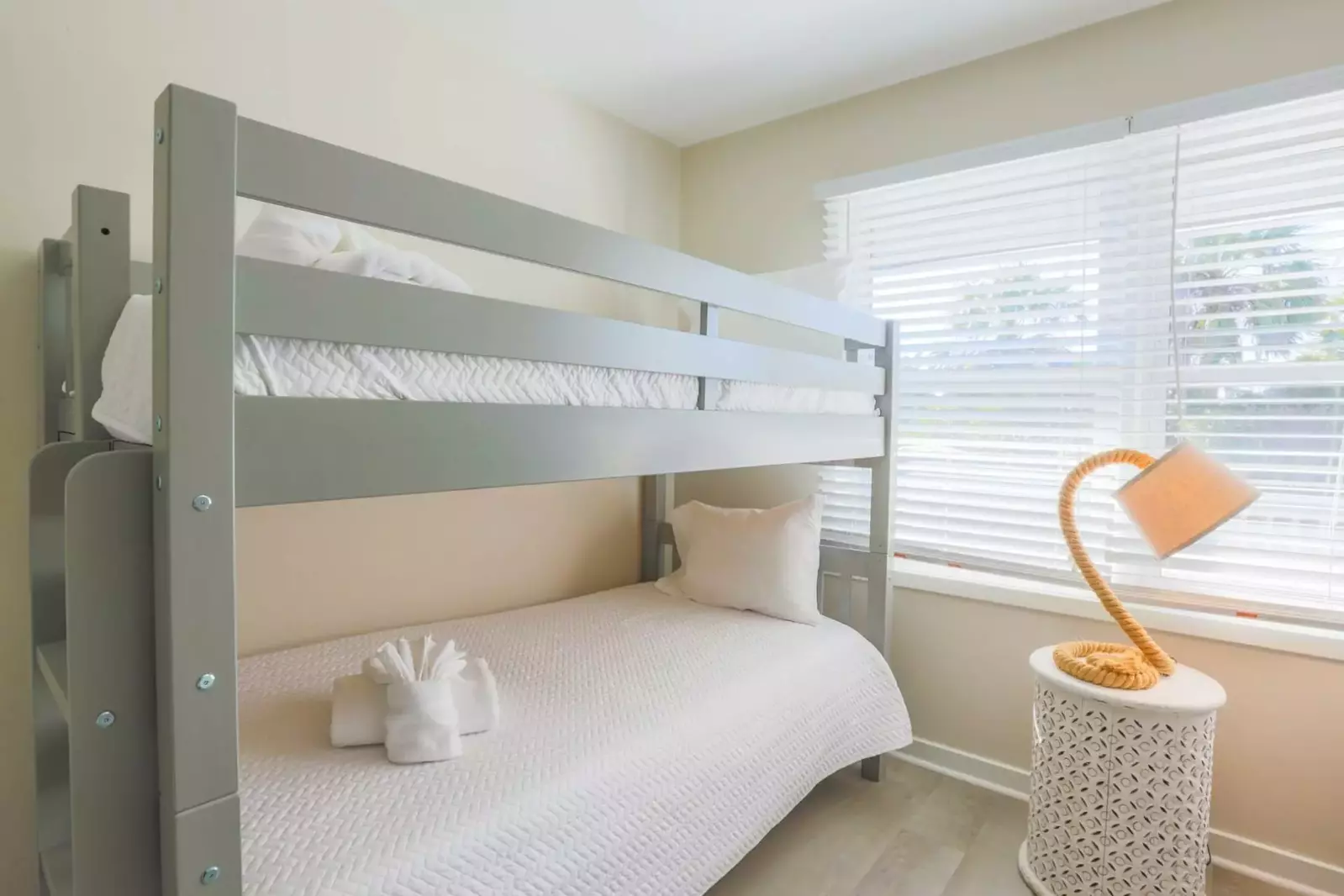 This bunk bedroom is located in the back corner of the house and looks out onto the backyard.