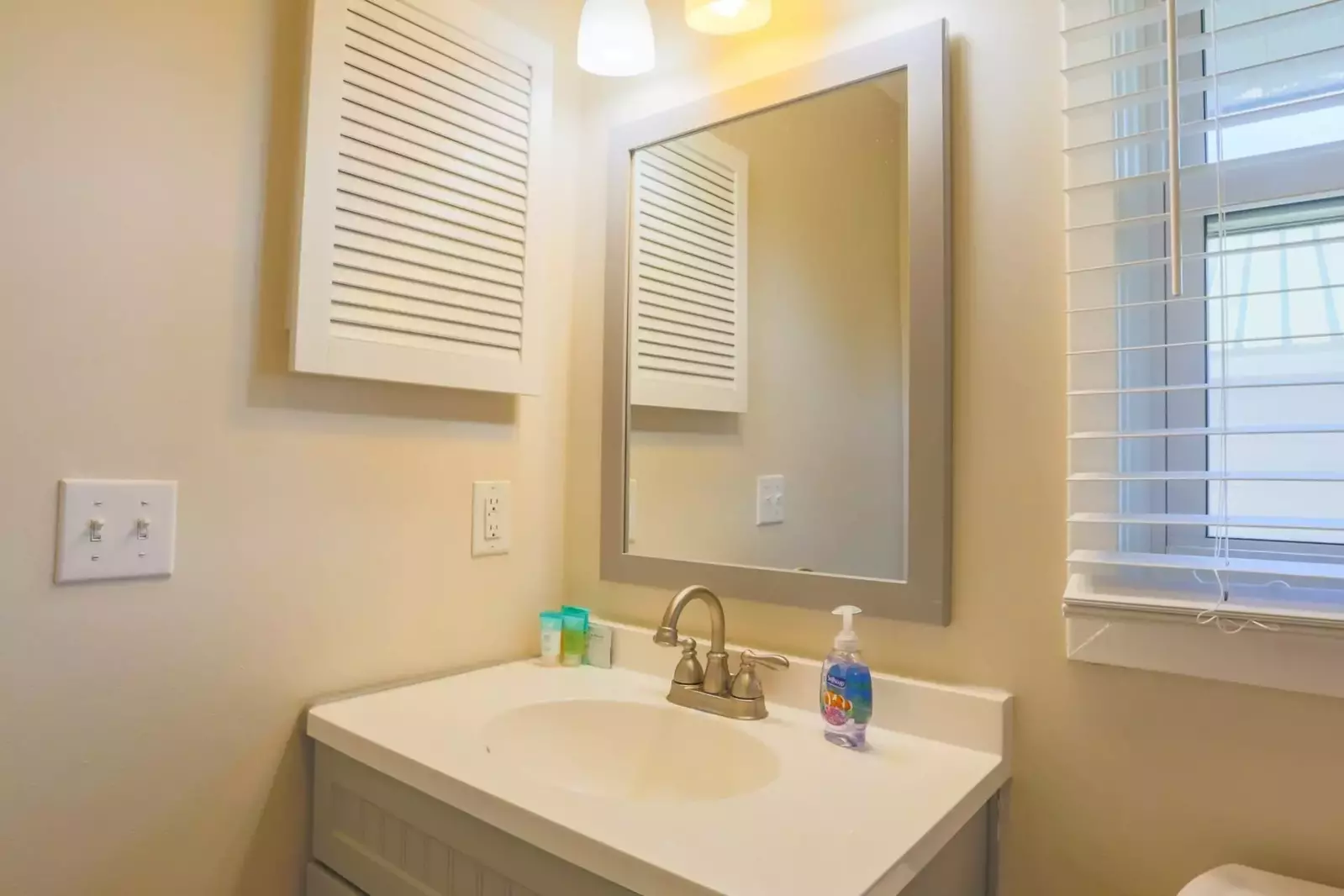 This bathroom is located off the hallway near the two guest bedrooms.