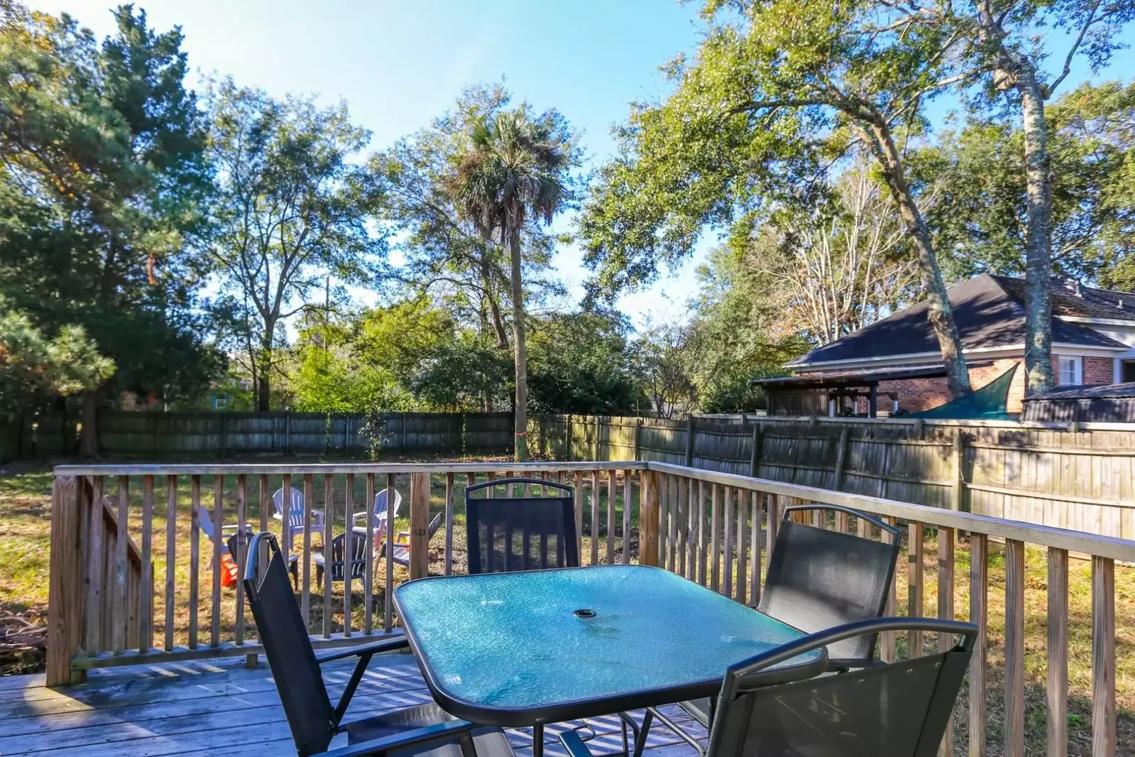 The outdoor dining table seats 4 people.