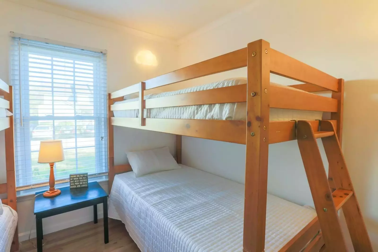 The kids bunk bedroom has two bunk beds for a total of four twin size beds.