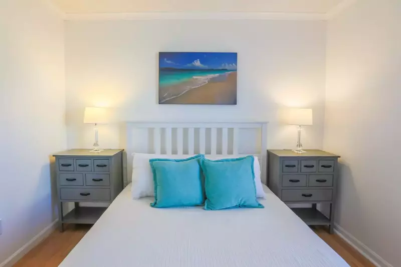 Queen's Court has hardwood floors throughout the living room, hallway and bedrooms.