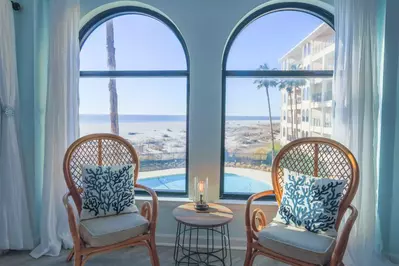 You'll never tire of the gorgeous views of the community pool, palmetto trees, sand dunes & ocean waves.