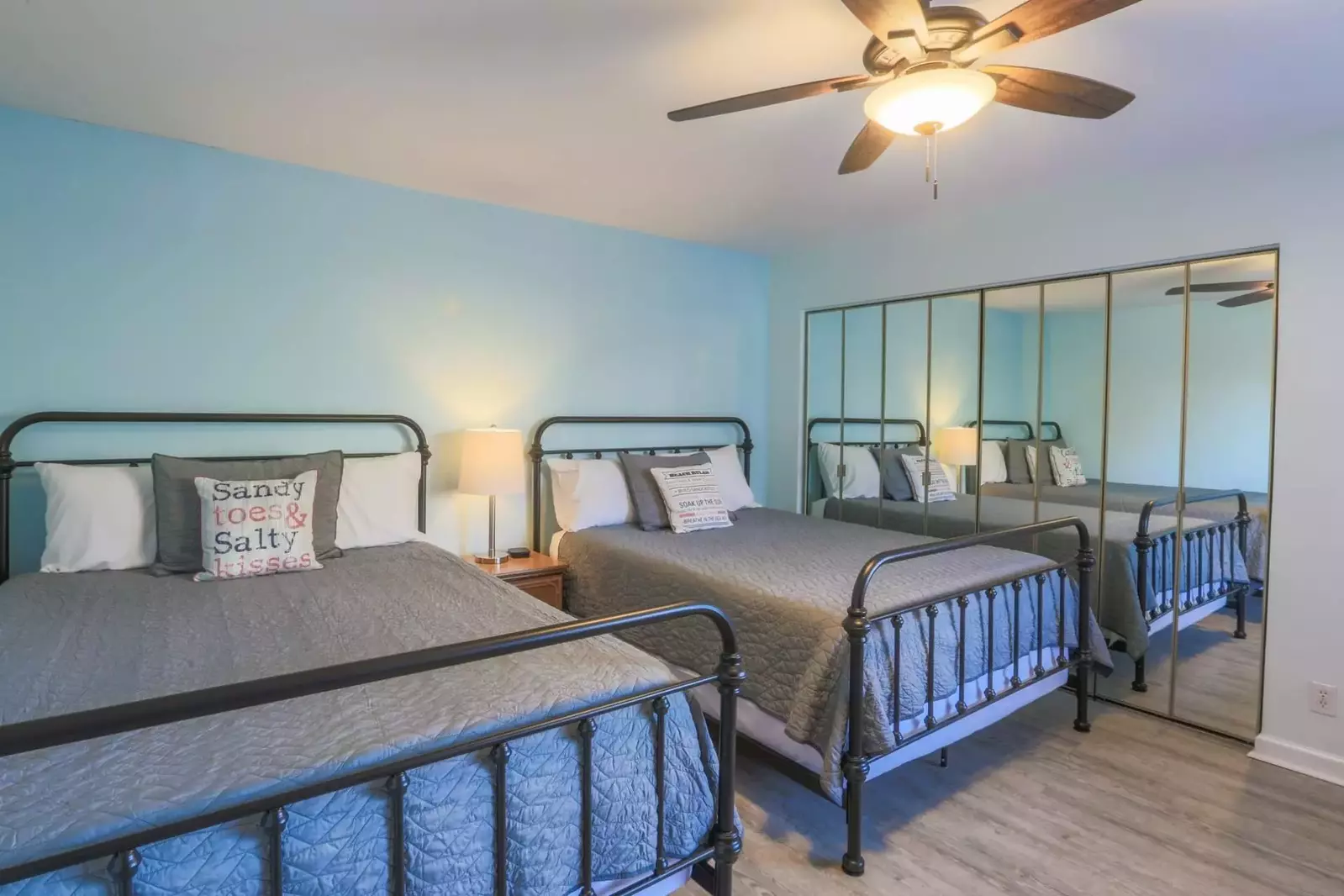 The guest bedroom features two queen beds.
