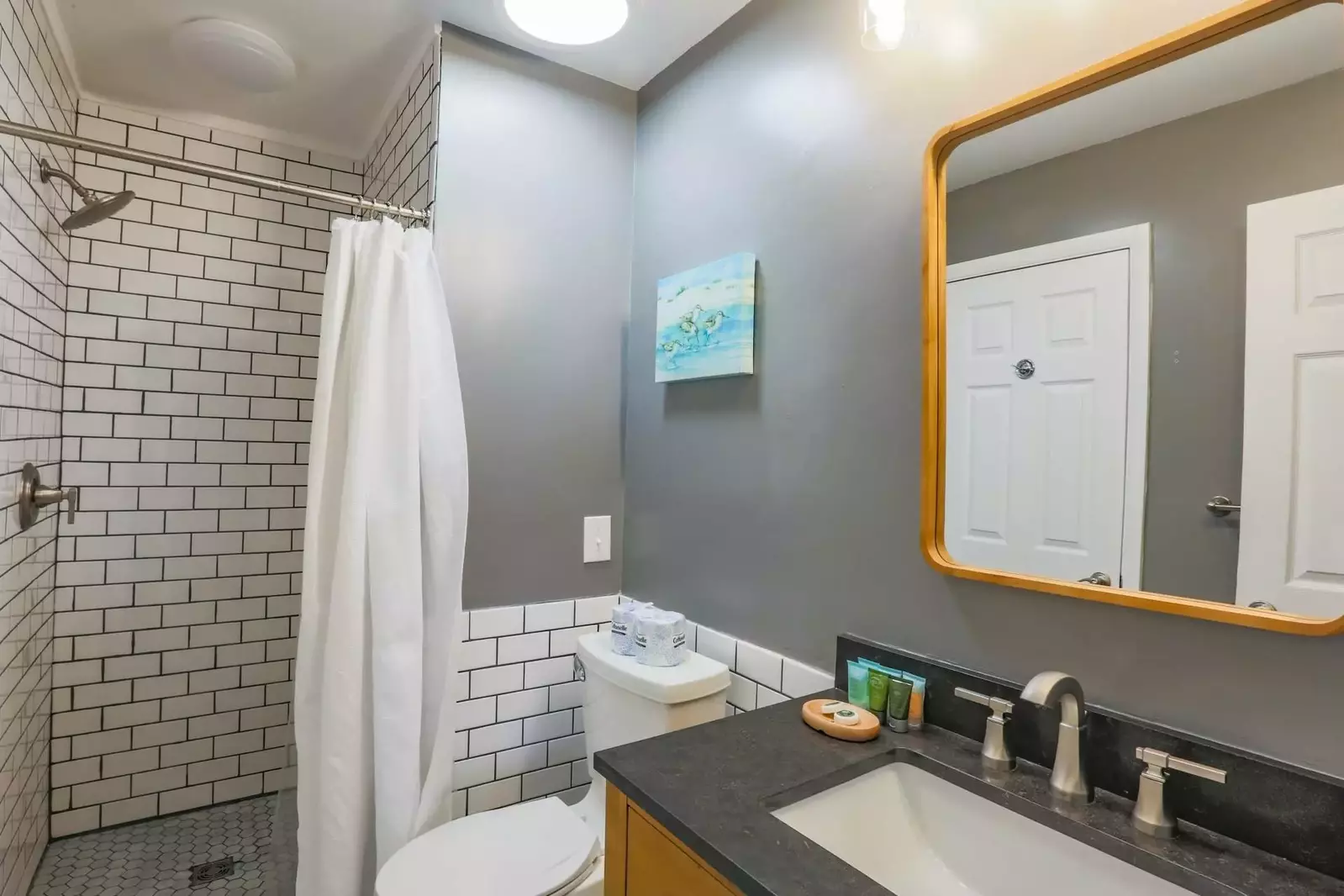 The second bathroom features a tiled, walk-in shower!