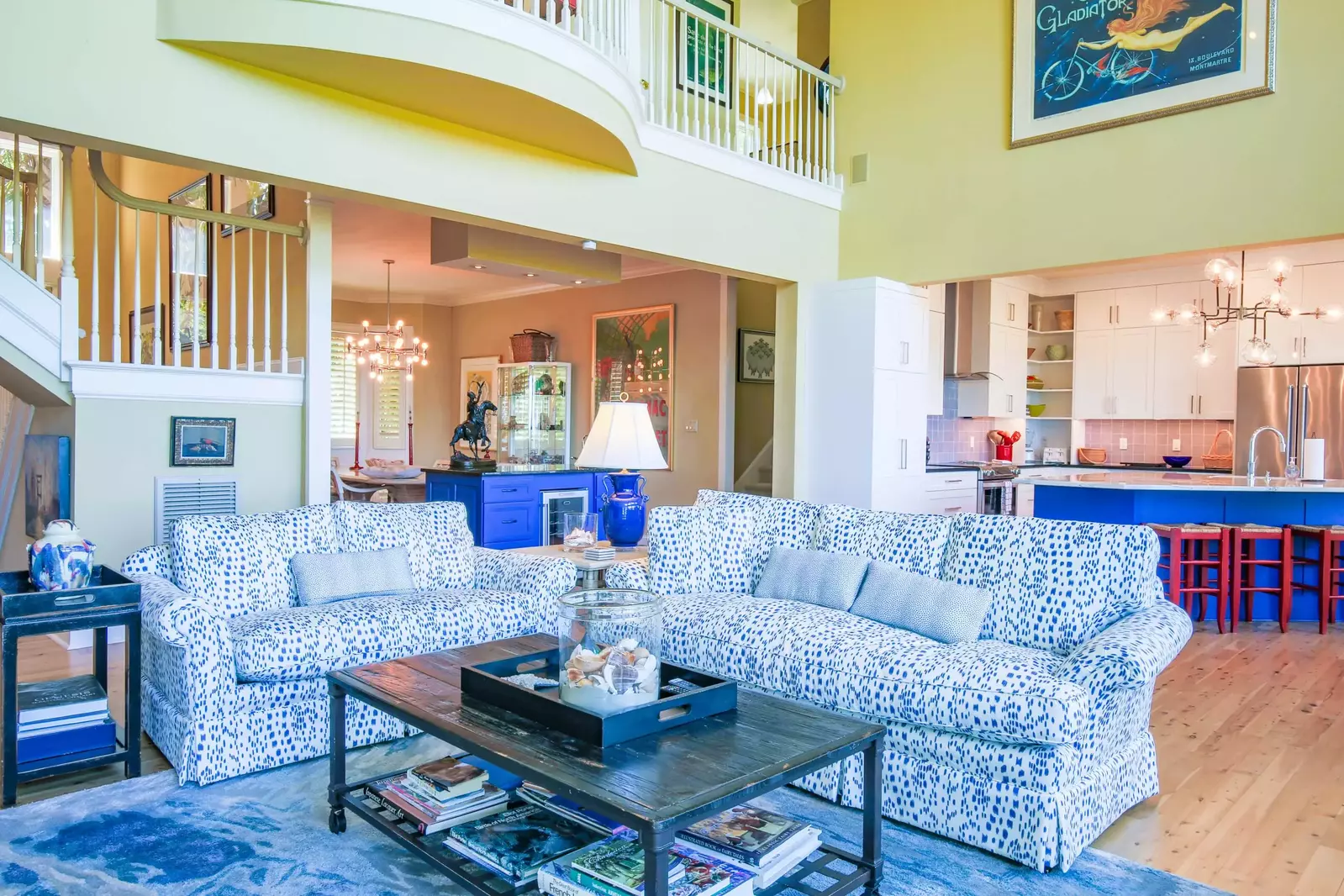 The Great Room features double height celings and an open floor plan layout into the kitchen.