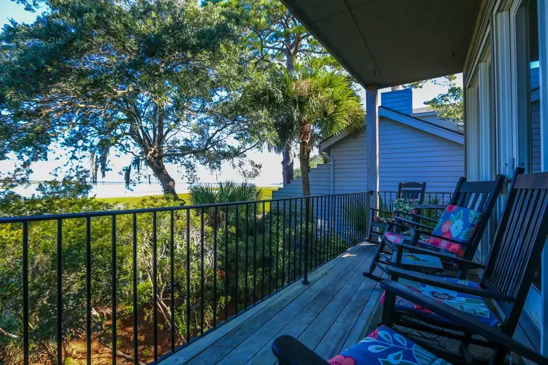 Palmetto trees, live oaks with Spanish moss and pine trees surround the home.