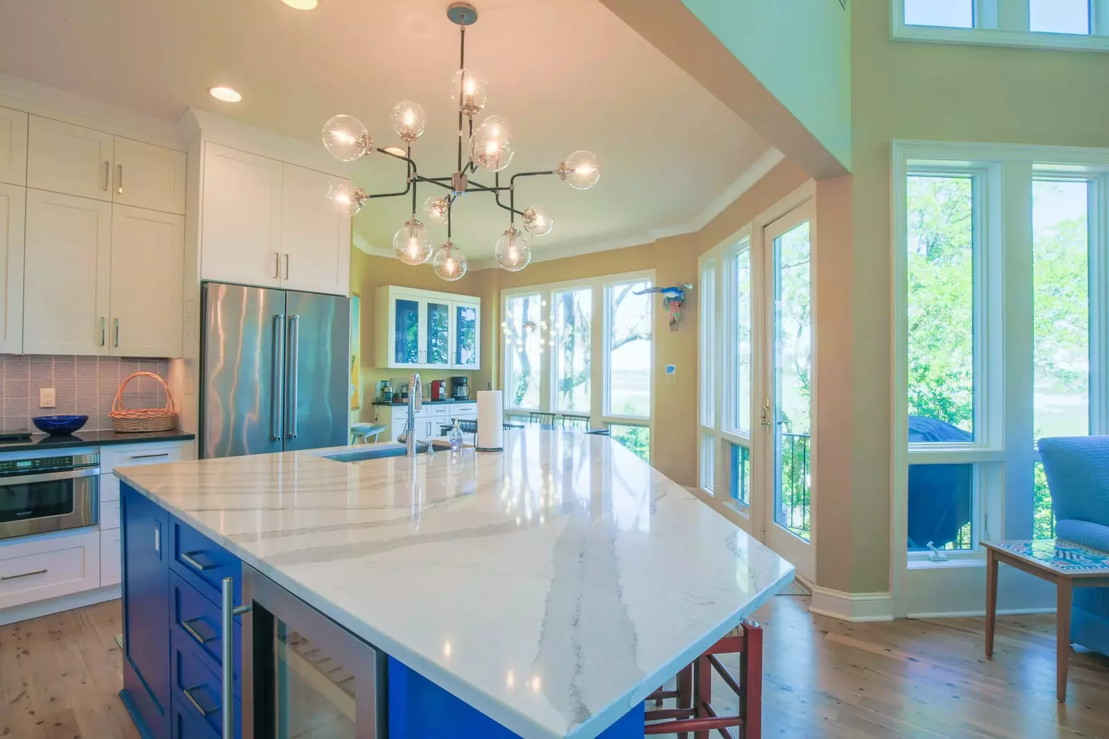 The gorgeous kitchen features stainless steel appliances and quartz countertops.