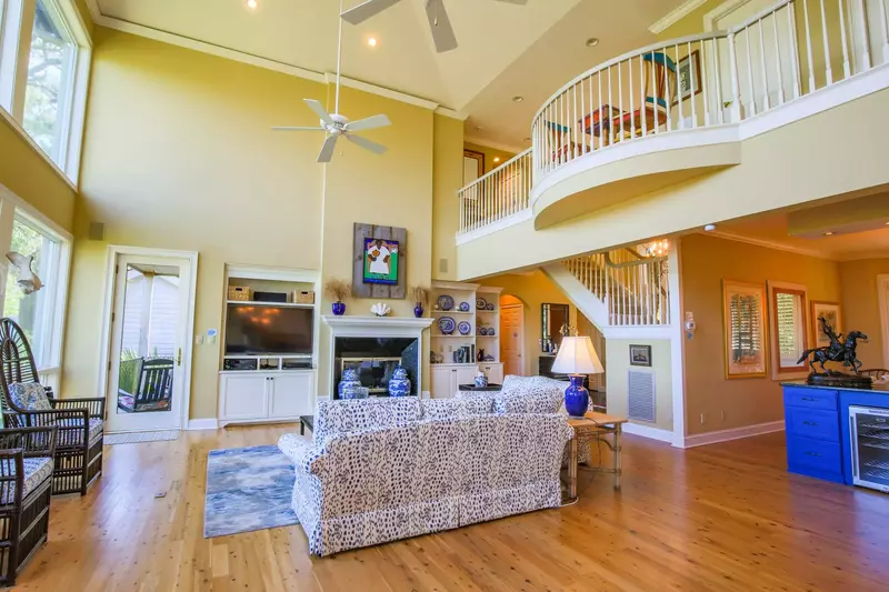 The home's formal dining room is located just behind the blue wet bar.