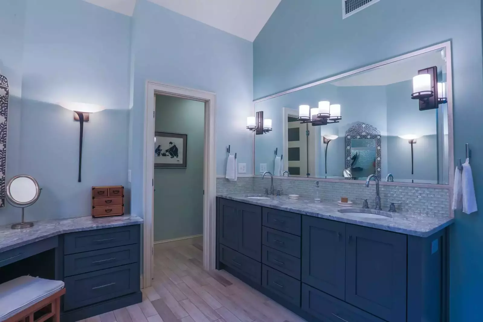 The pristine master bathroom has a double sink vanity and a separate water closet.