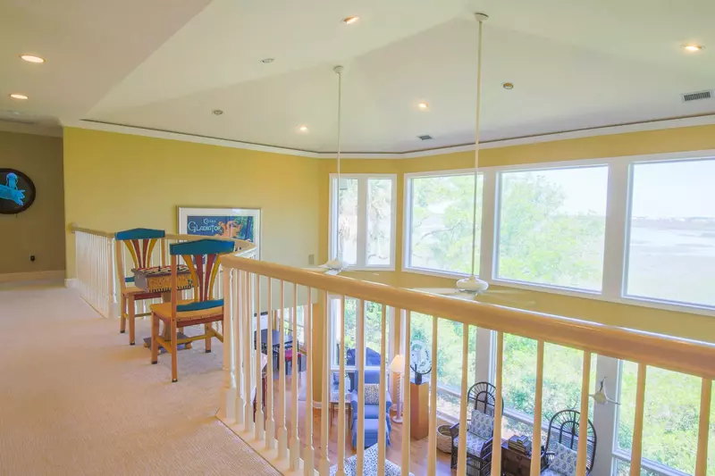 This landing connects the master bedroom suite with one of the home's guest suites.