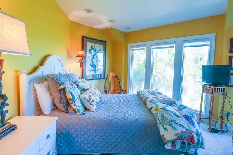 This guest suite features a queen bed, cable TV and marsh views.