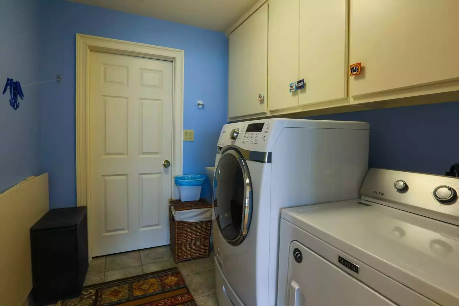 This laundry room with full sized washing machine and dryer are located on the home's second floor.