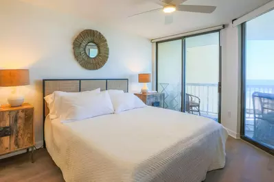The master suite boasts ocean views and access to to the covered patio.