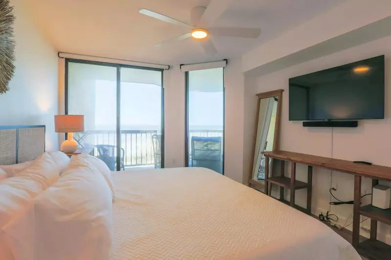 There is also a ceiling fan, mounted large screen smart TV and mounted Sonos sound bar.