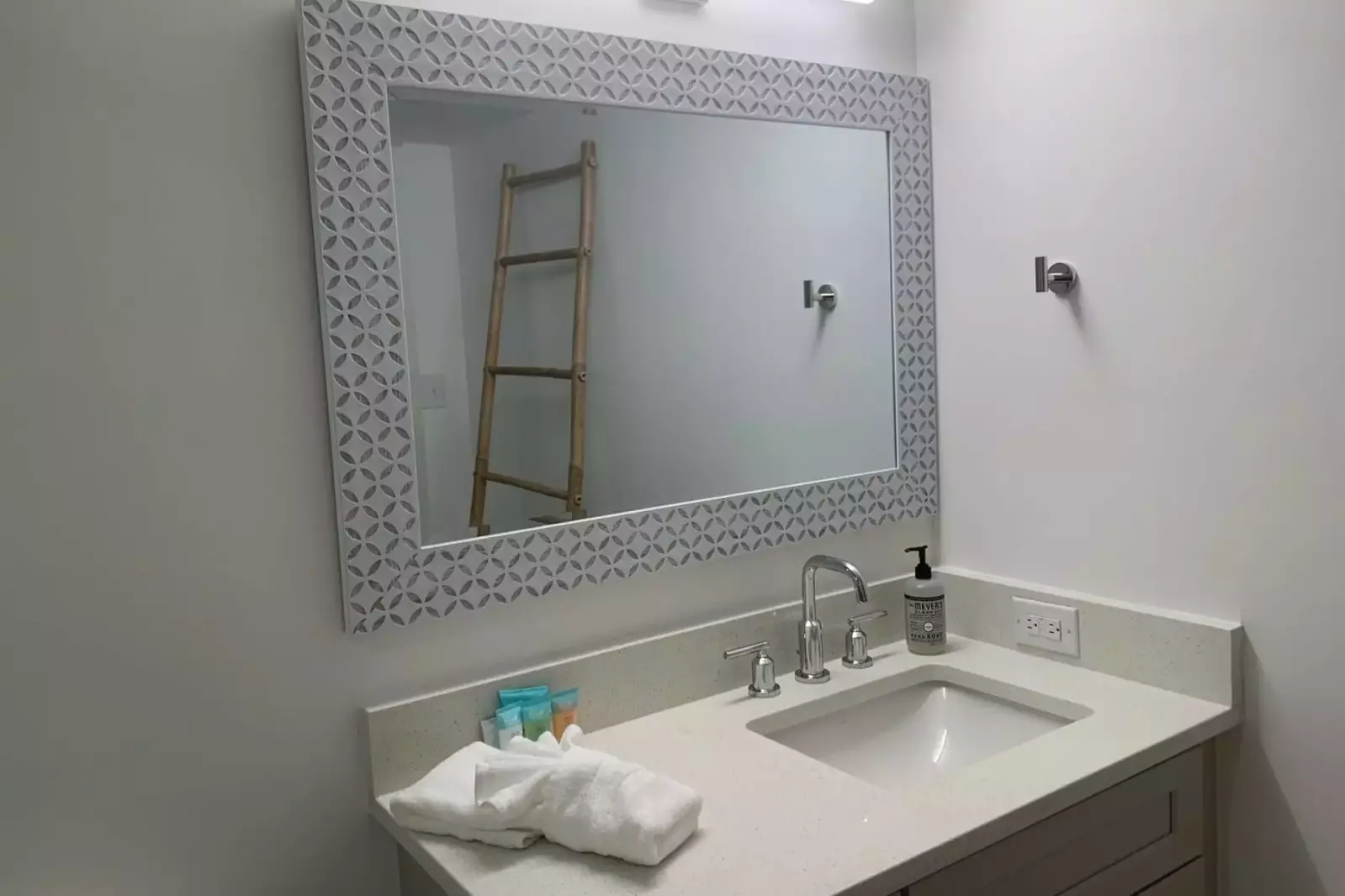 The en suite bathroom for the second master features a spacious vanity.