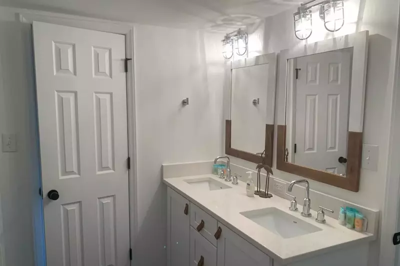 This bathroom -- with its double sink vanity -- separates the bunk bedroom and the guest bedroom.