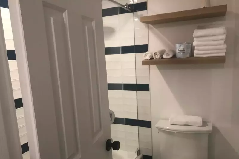 The Jack & Jill bathroom features a separate room for the toilet & shower/tub combo.