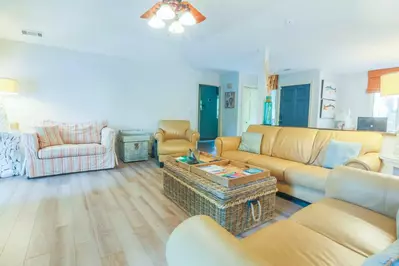 When you enter the blue front door, you'll find the home's large living room.
