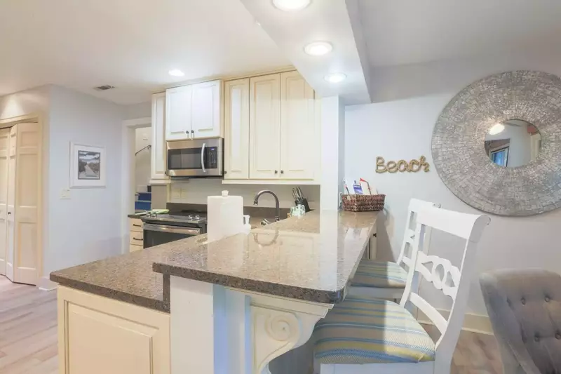 There is a high top counter seating area, that separates the kitchen from the dining room.