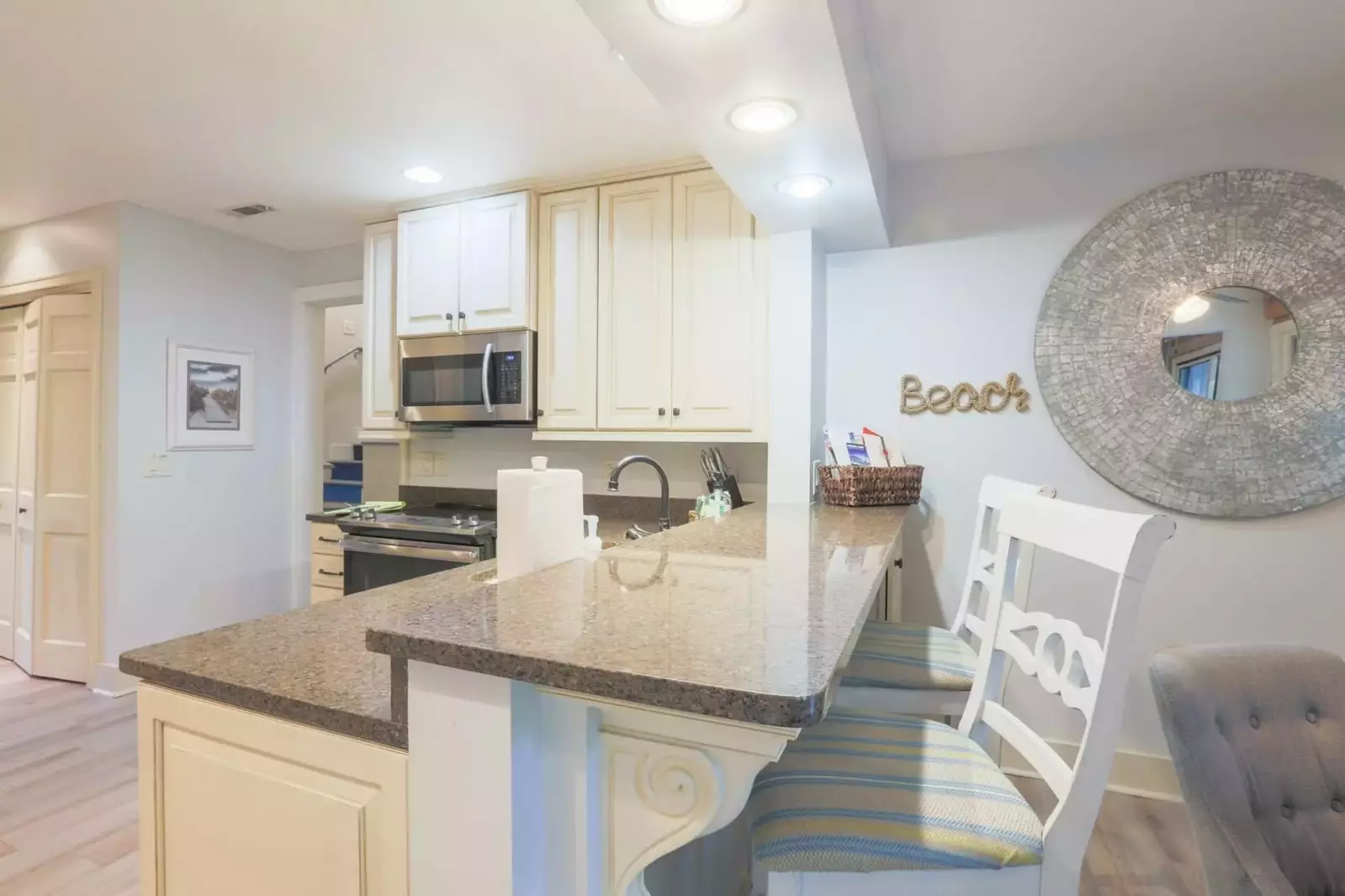 There is a high top counter seating area, that separates the kitchen from the dining room.