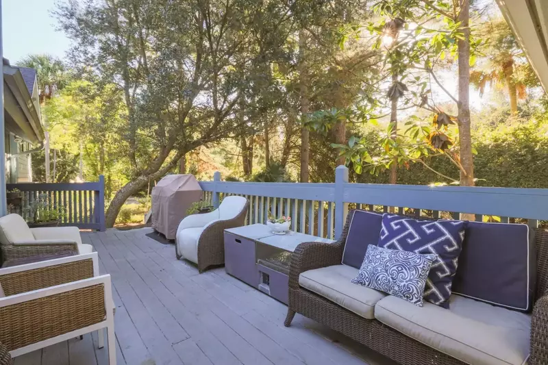 The back deck has a cosy seating area and propane BBQ grill.