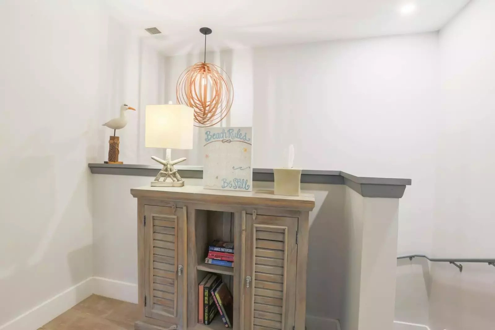 A half staircase takes you from the kitchen area to the home's second master suite and one of the guest bedrooms.
