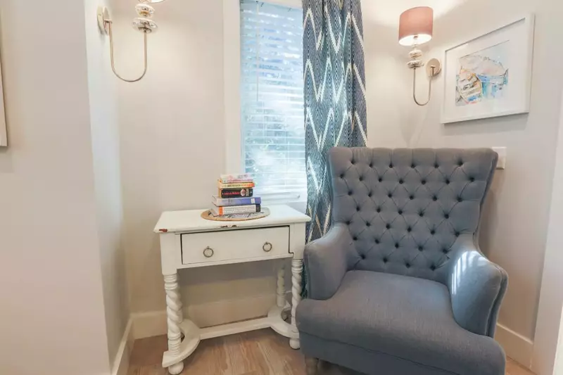 This comfortable seating area is tucked away in the corner of the master suite.