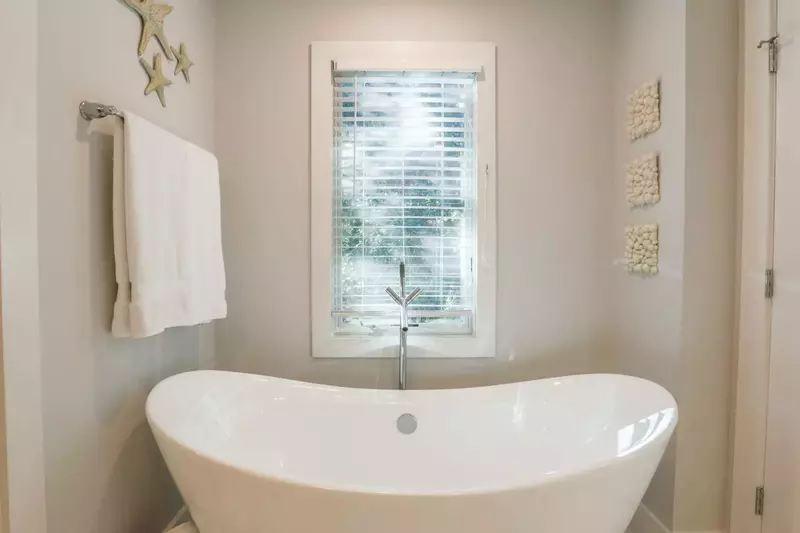 Soak all your cares away in the freestanding bath tub.