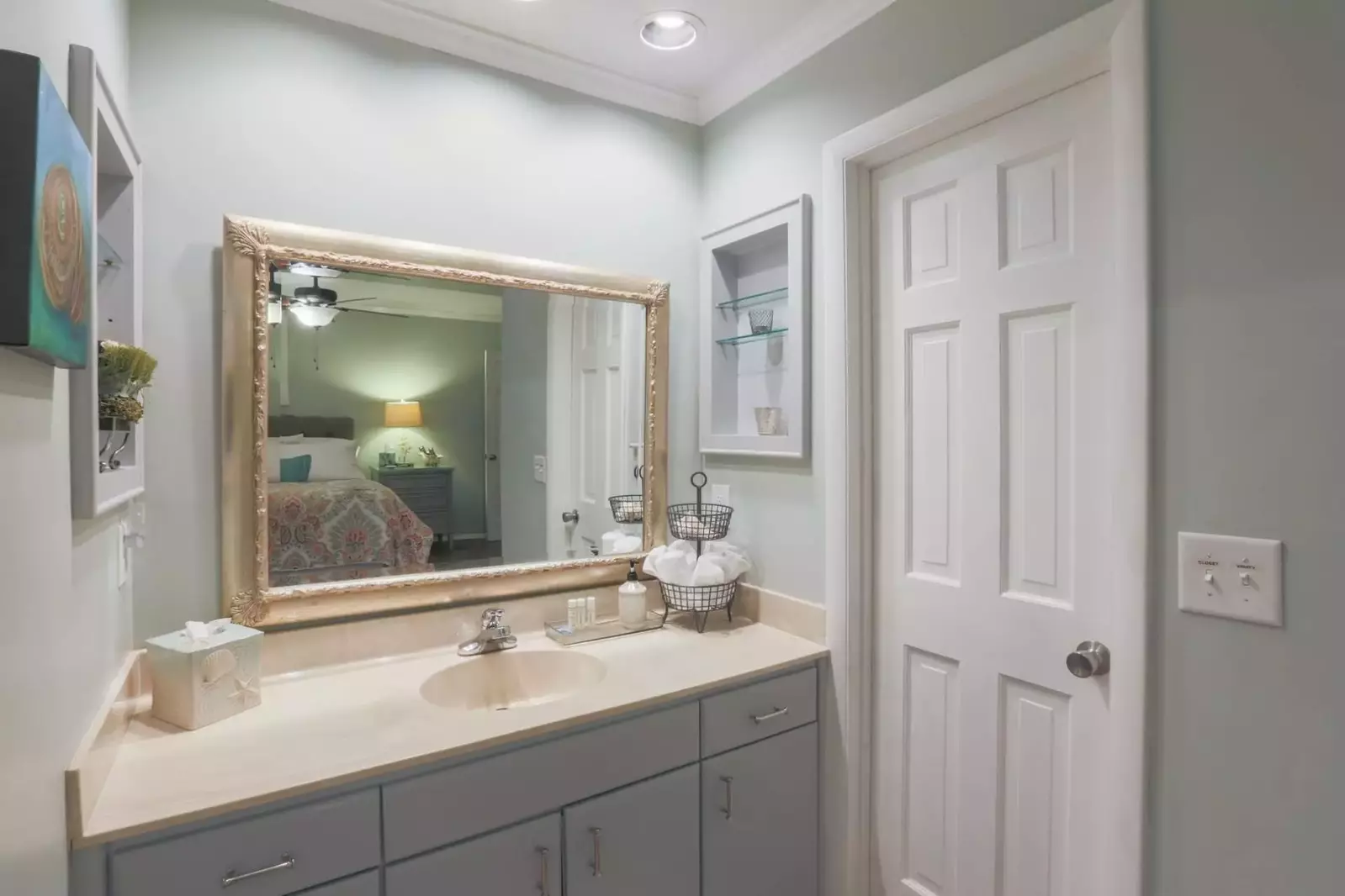 The bathoom area has a spacious vanity with plenty of storage area for your personal items.