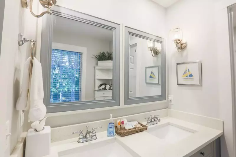 The renovated en suite bathroom for the bunk bedroom has a double sink vanity.