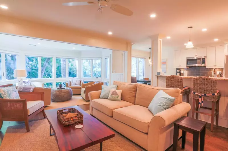 The glassed-in porch provides a perfect second seating area in the living room.