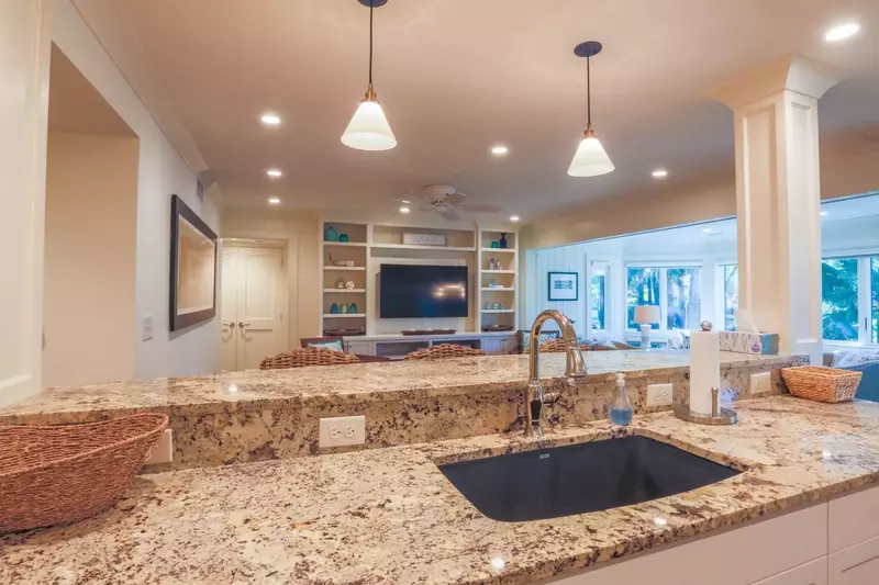 The open floor plan layout makes it easy to interact with friends & family in the kitchen, living & dining room areas.