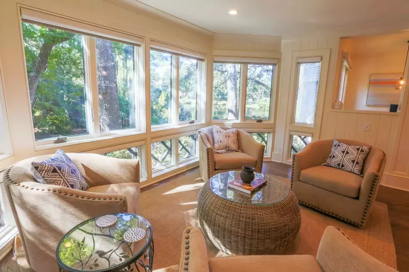 The wall of windows in this seating area provide gorgeous sunlight and views.