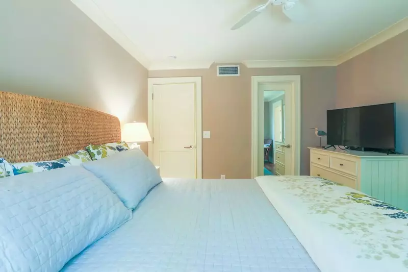 The master bedroom also has a large screen smart TV, dresser and closet.