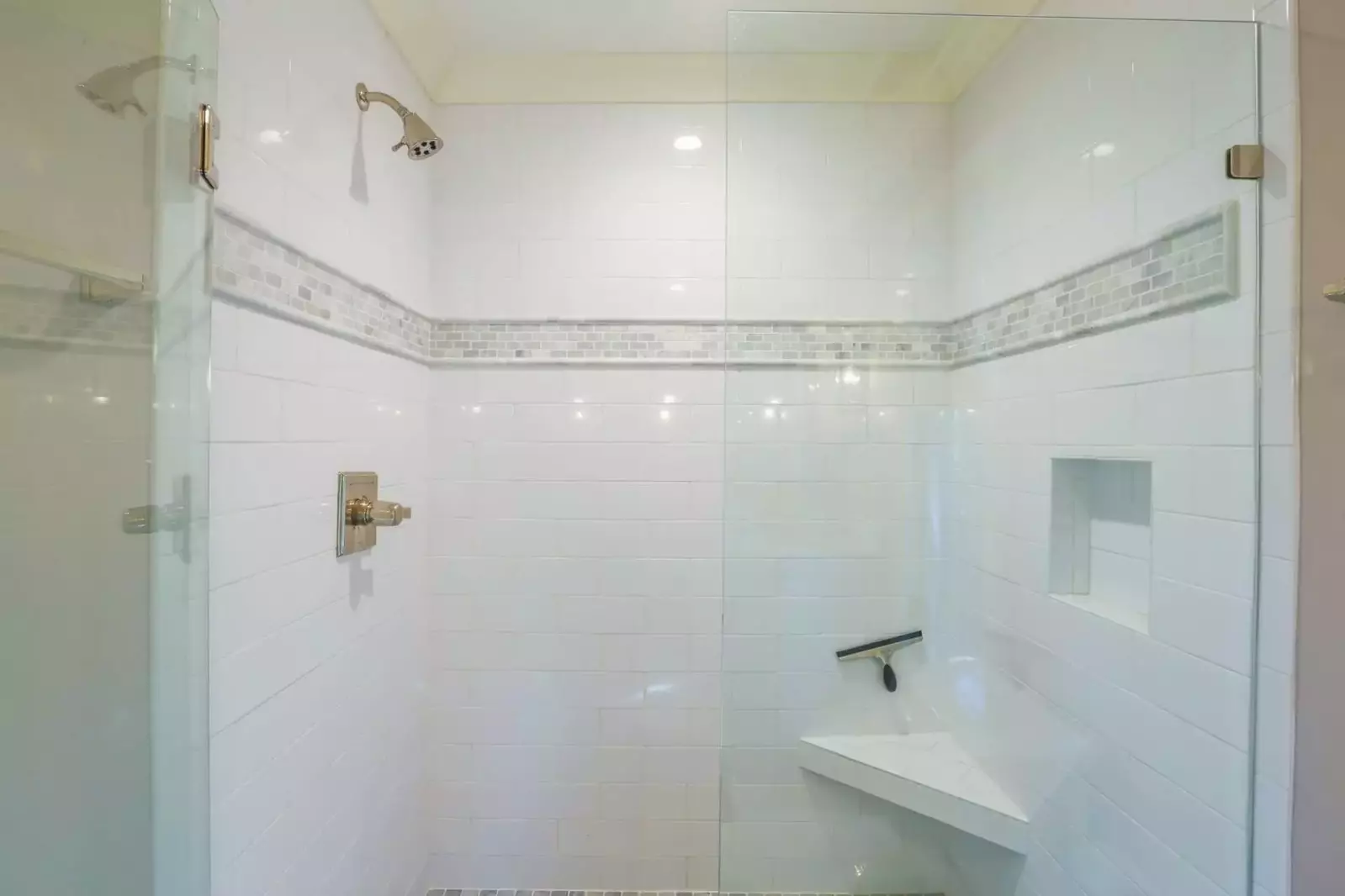 The master bath also features this beautifully tiled walk-in shower.