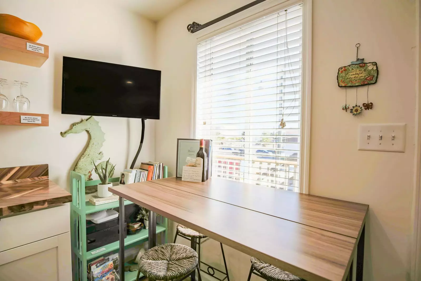The dining table in the kitchen comfortably seats 4 people.
