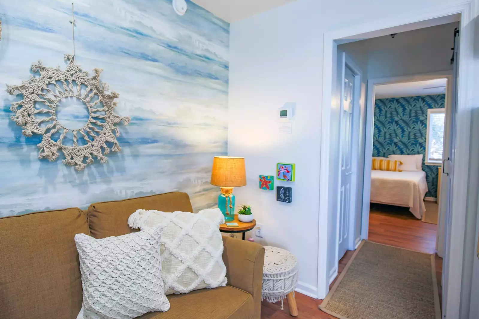 The bathroom and closet divide the bedroom from the living room, kitchen & dining area.