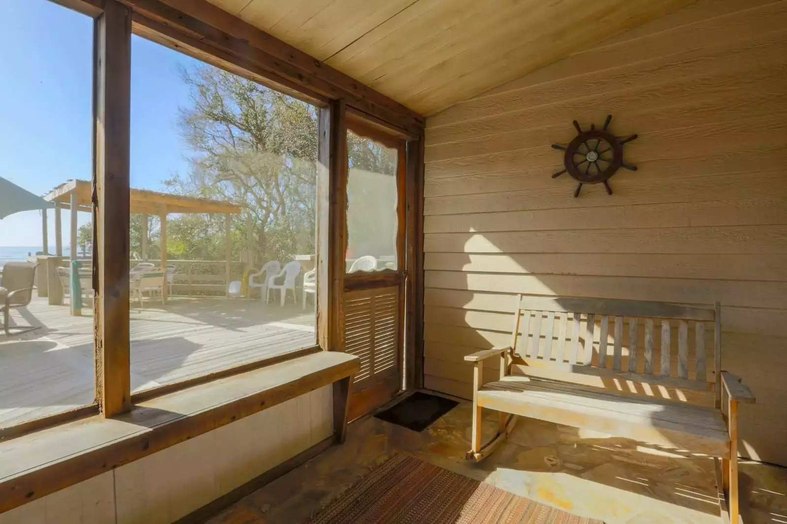 Read a book and feel the cool seabreezes in our screened-in porch.