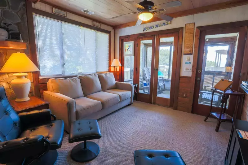 Access the screened-in porch and the back sundeck via the doors in the living room area.