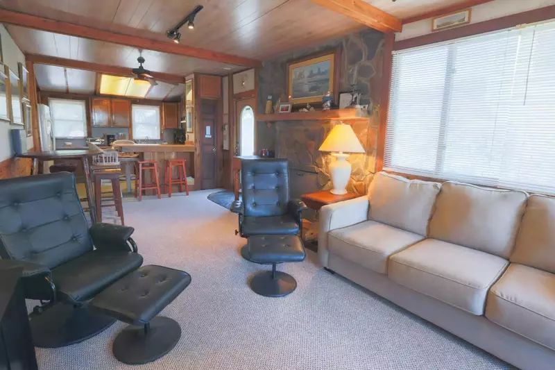 The open floor plan layout makes it very easy to interact with guests in the kitchen, dining area & family room areas.