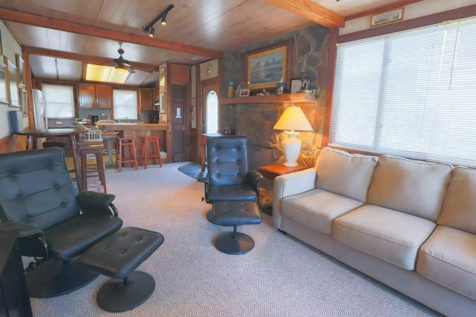 The open floor plan layout makes it very easy to interact with guests in the kitchen, dining area & family room areas.