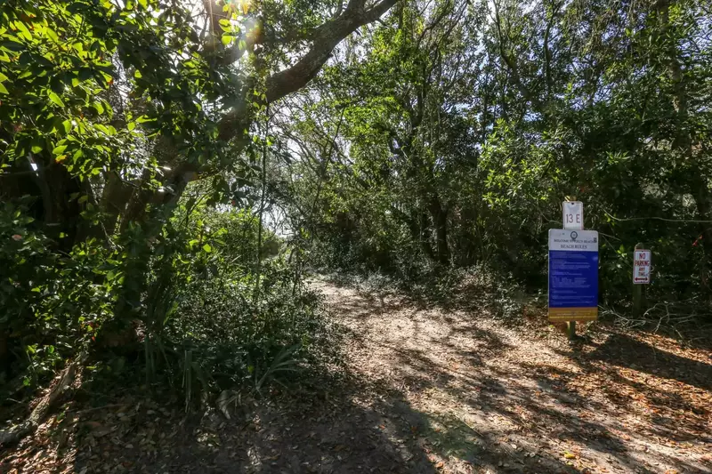 The beach access is located right next door to the home.