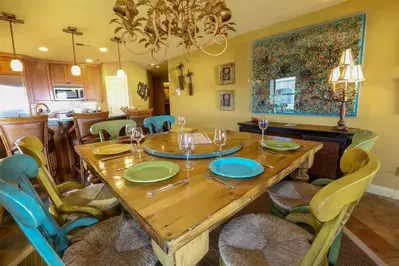 The gourmet kitchen and charming dining room are perfect for dinner parties!