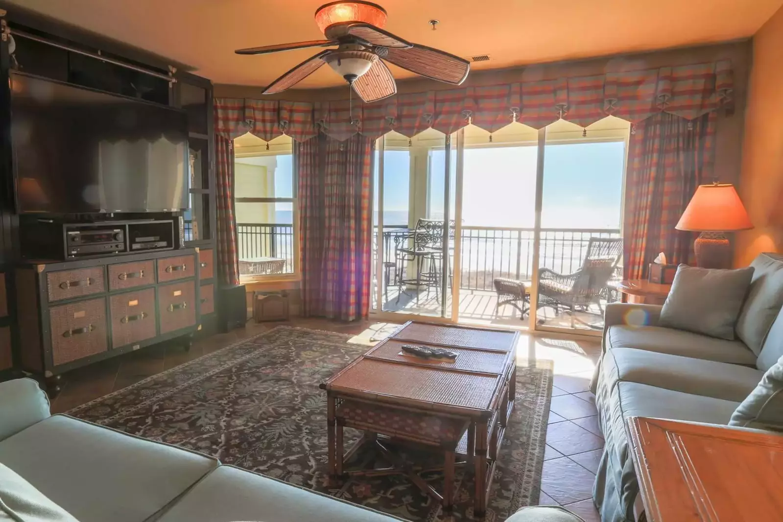 Enjoy the big screen TV and beautiful decor of our beachfront condo!