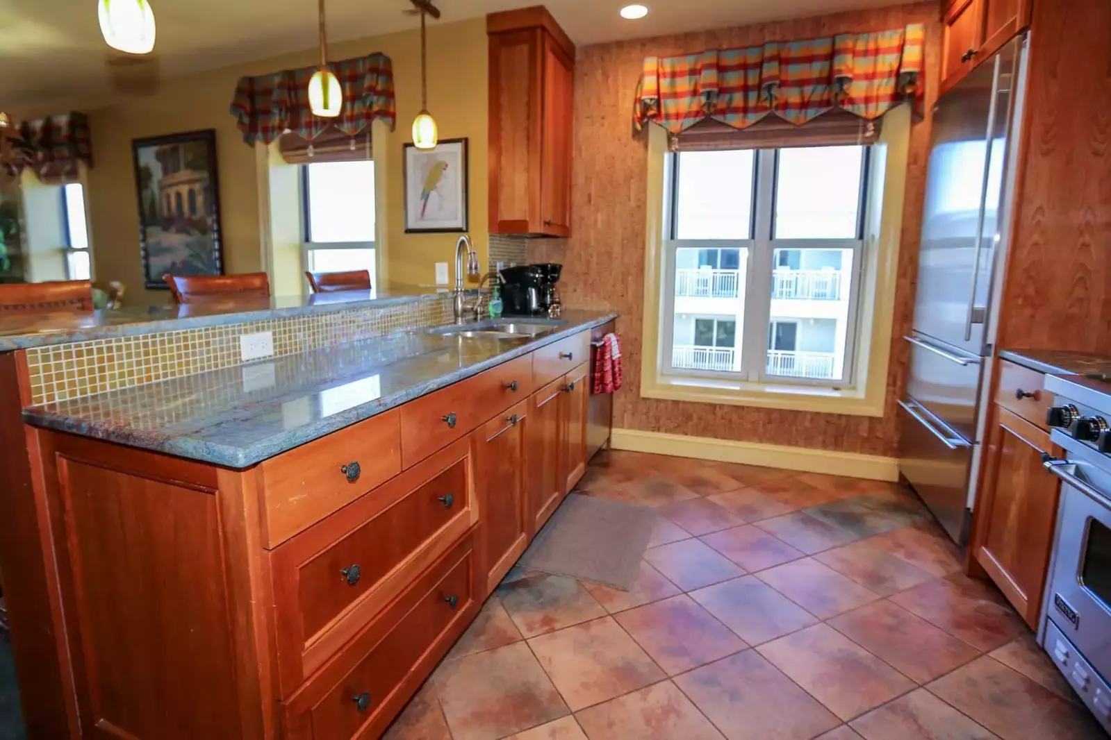 Cook a feast in this beautiful galley kitchen with the Viking oven & stove and Sub-Zero refrigerator.