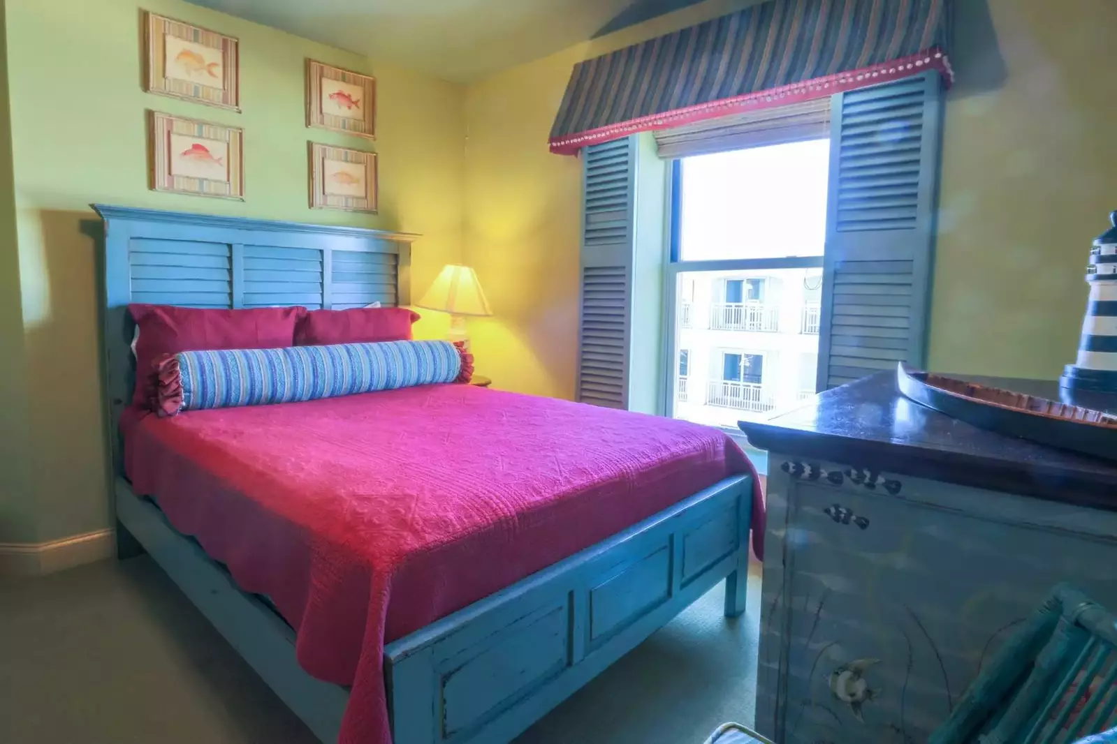 This guest bedroom has a queen-sized bed, beautiful decor and cable TV.